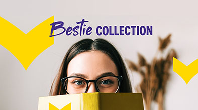 A woman wearing glasses peeks over the top of an open book